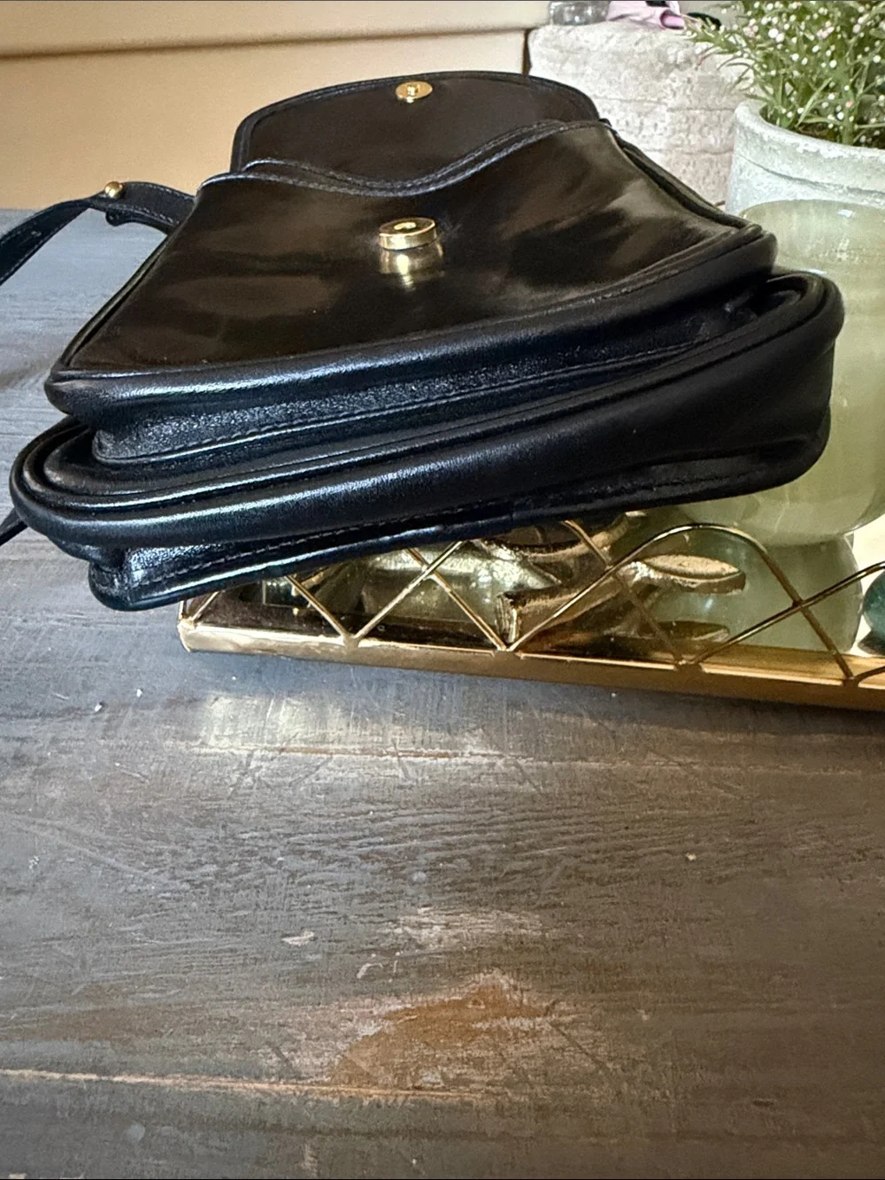 Brahmin Black Leather Messenger Bag with Gold Medallion